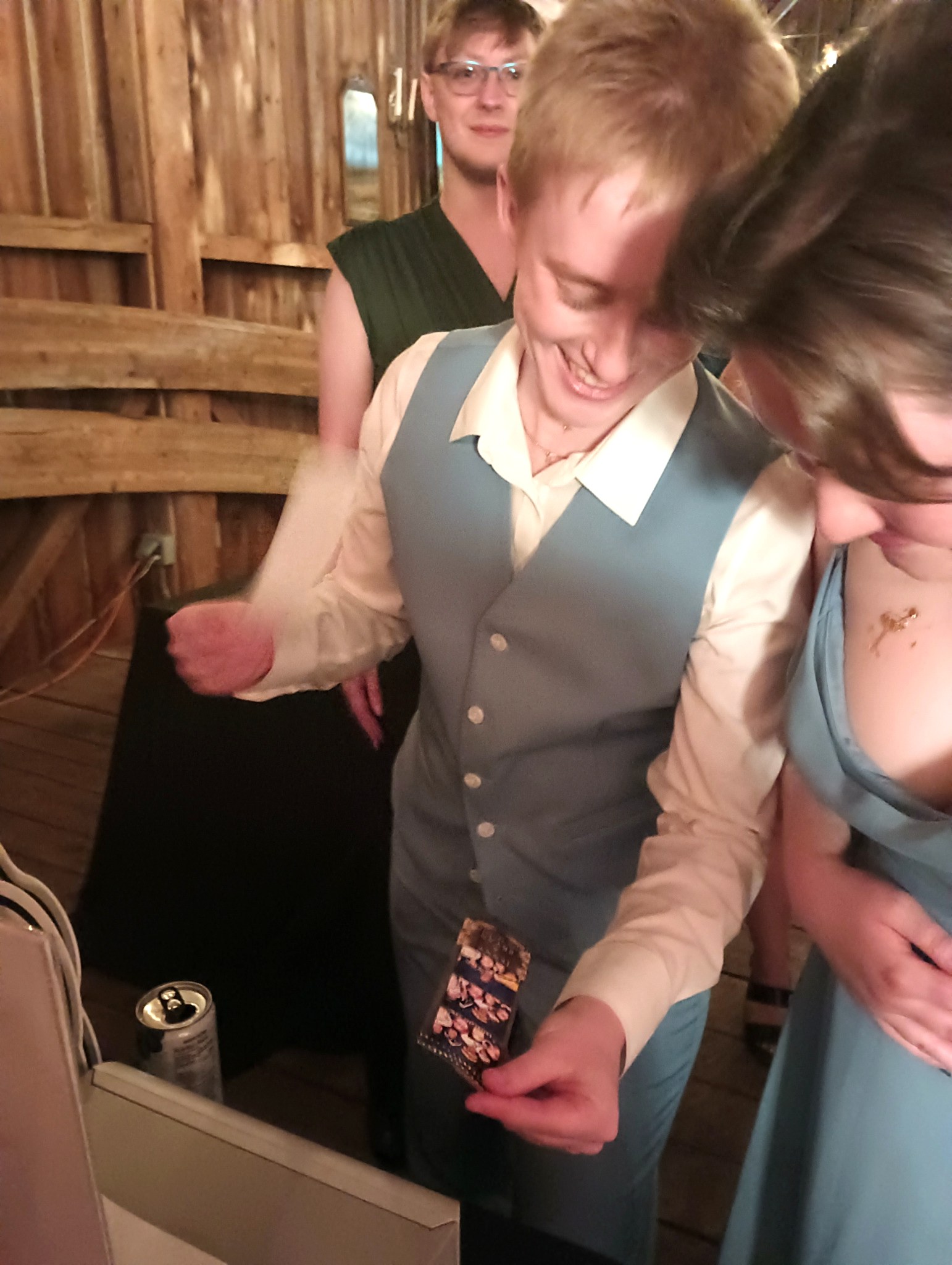 Guest holding a freshly printed photo booth picture
